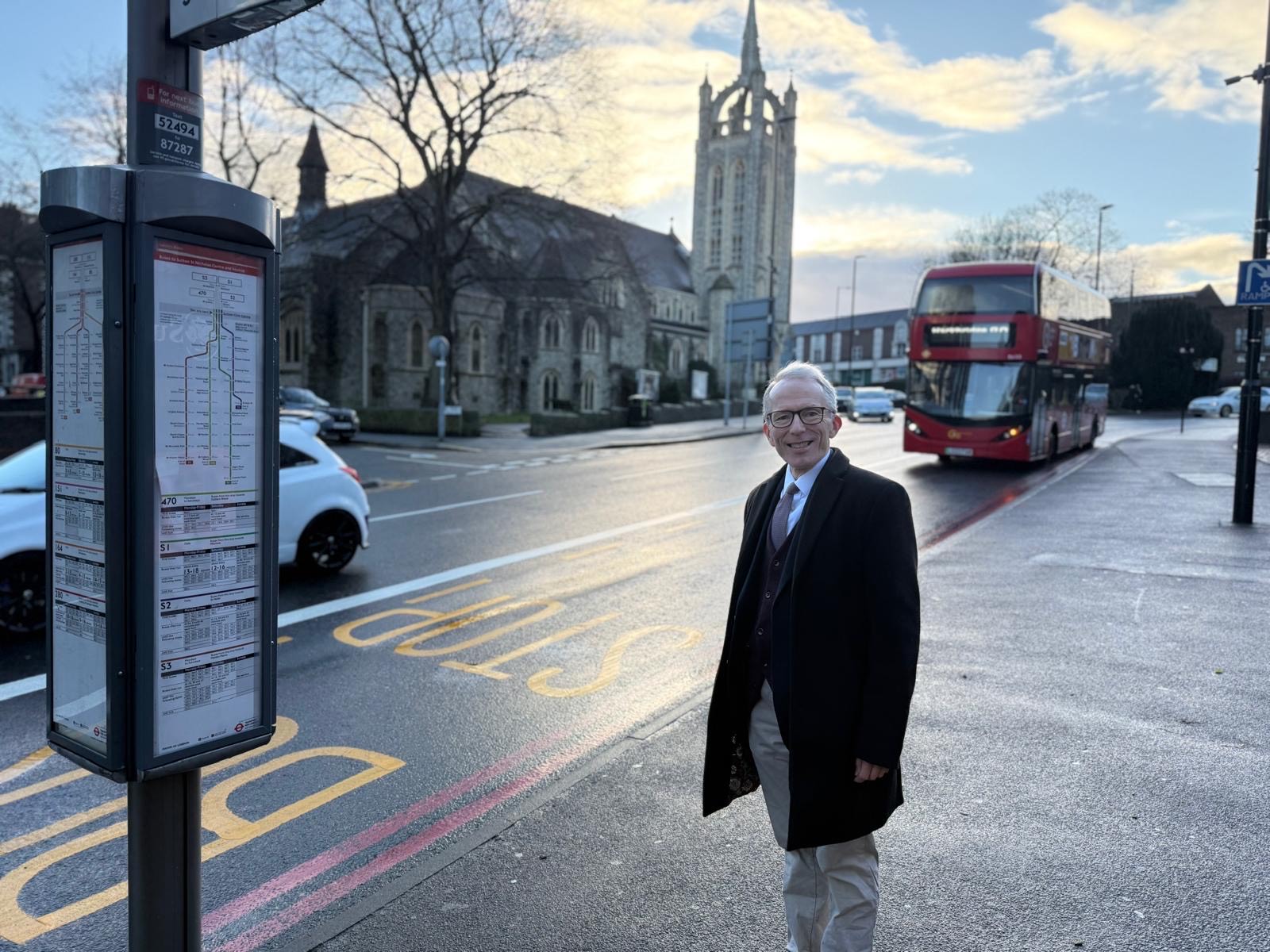 Councillor Christopher Woomer  Lead Member for Transport  waiting for a bus