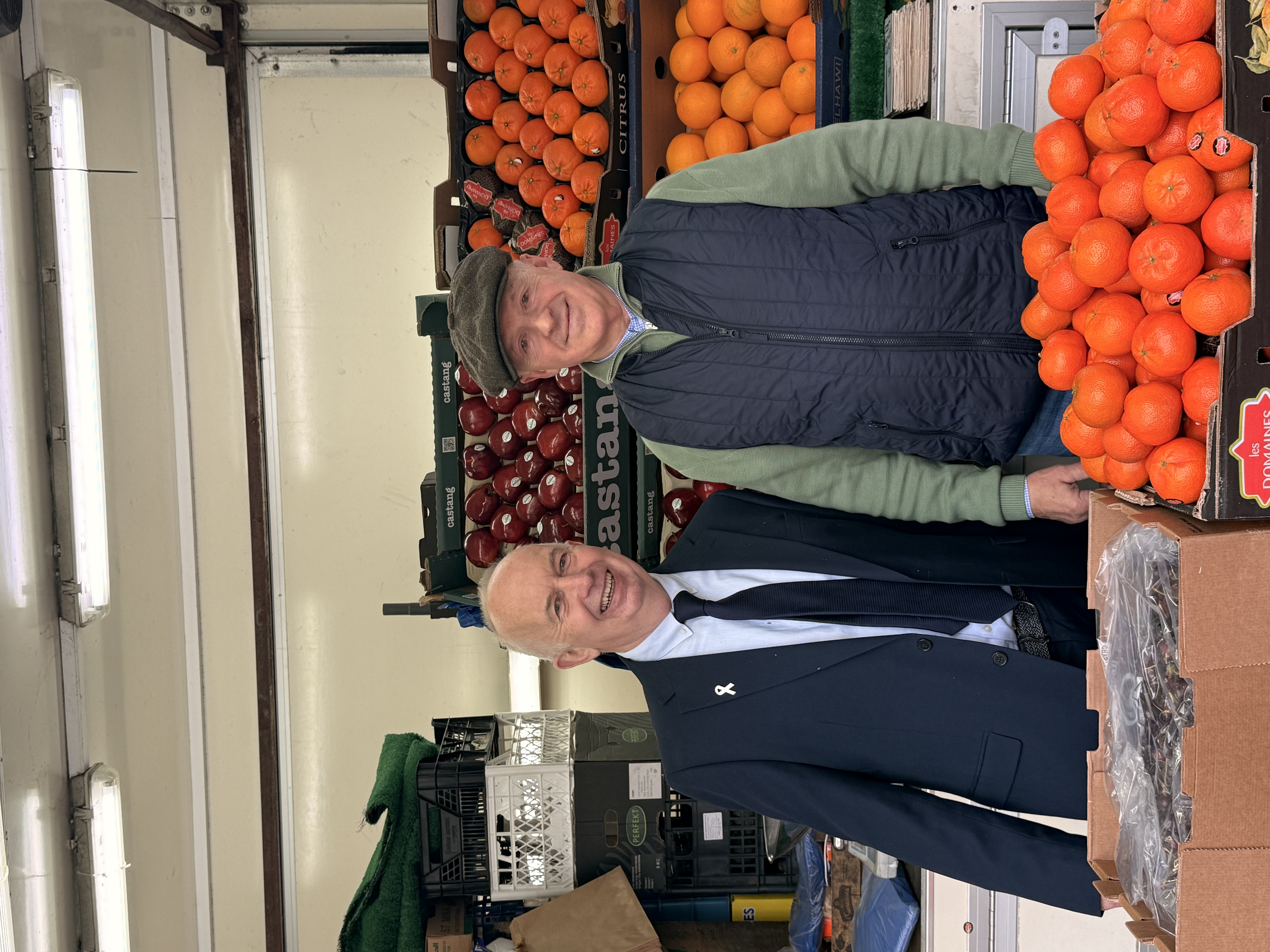Councillor Barry Lewis, Leader of Sutton Council with Dennis at his fruit and veg stall in Sutton High Street