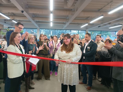 Student Heather cuts the ribbon to mark the opening of the Sutton Life Centre