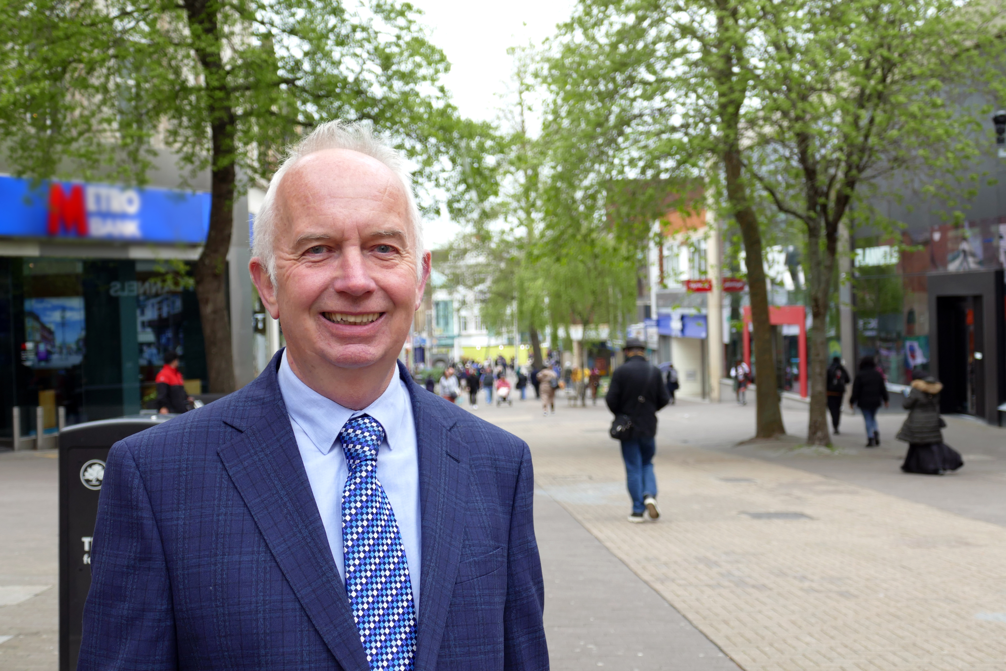 Image of Cllr Barry Lewis stood on Sutton high street