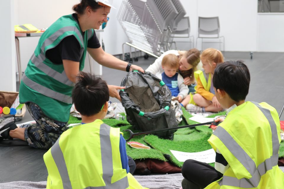 Amy Rhodes leading an interactive session in front of young children