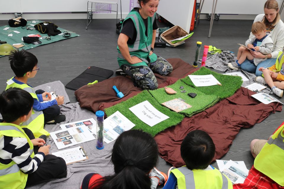 Amy Rhodes leading an interactive session in front of young children