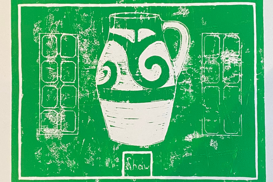 Stamp-printed image of an ornate jug coloured majority green and white